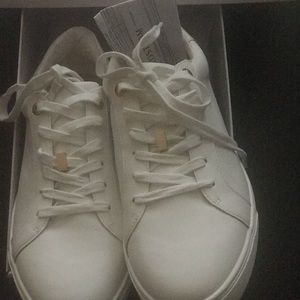 White Top Shop Sneaker w/ gold accents.